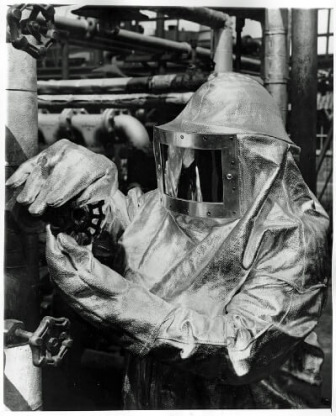 Worker in silver protective suit with hood