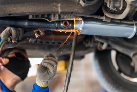 auto mechanic under car