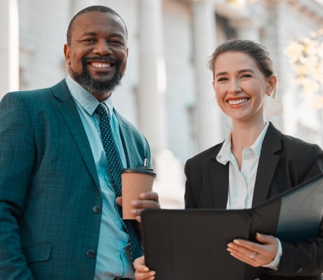 male and female lawyer smiling