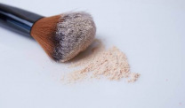 Makeup brush with powder