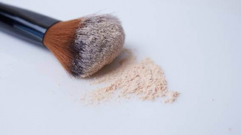 Makeup brush with powder