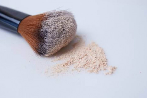 Makeup brush with powder