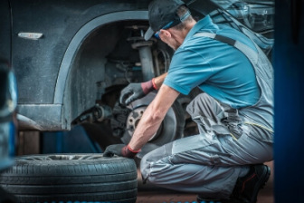 Mechanic looking at brakes