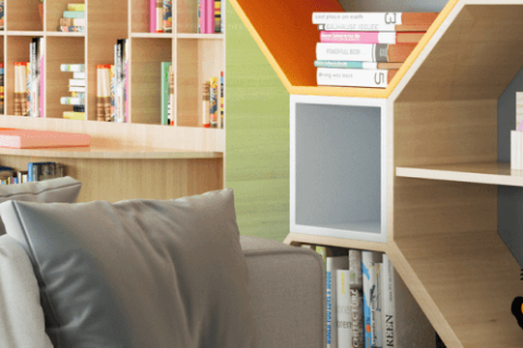 brightly lit hospital library with couches and books