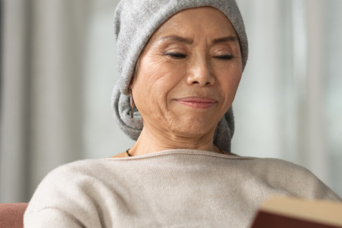 Cancer patient reading a book