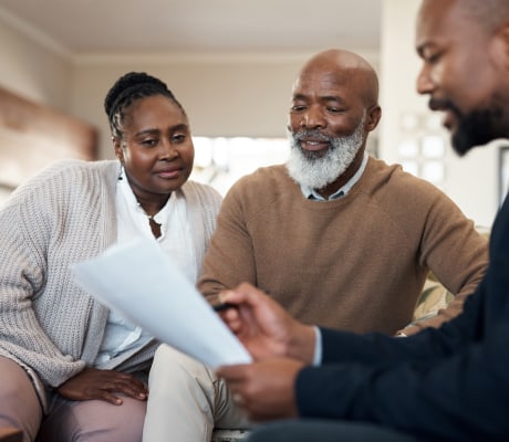 Lawyer with a clients looking at documents