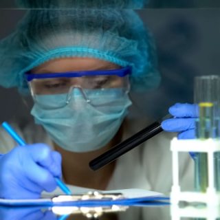 Doctor examining test tubes