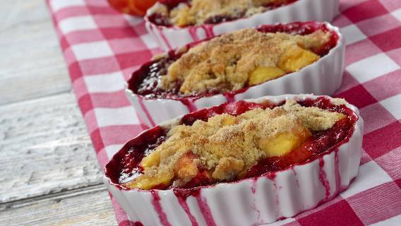 Raspberry nectarine cobbler on checked cloth