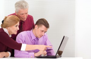 Family using computer to spread the word about cancer