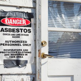 Condemned home with asbestos warning