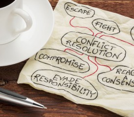 Napkin with ideas to resolve conflict.