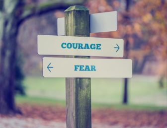 Signpost with courage and fear