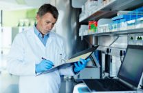 Technician documenting notes in a lab