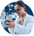 Scientist is laboratory studying cells under a microscope