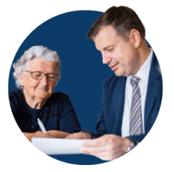Elderly woman having contract signed by an attorney
