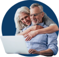man and his wife looking at computer together watching webinar from the mesothelioma center
