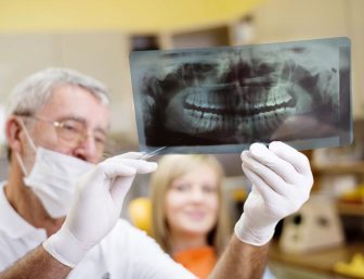 Dentist holding an X-ray