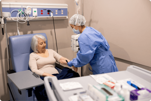 doctor administering cancer drug to patient