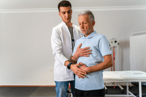 doctor checking breathing in patient