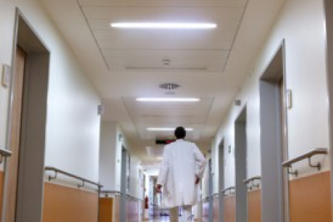 Doctor walking down a hallway