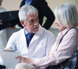 Doctor talking with woman