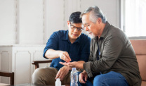Mesothelioma caregiver helping family member