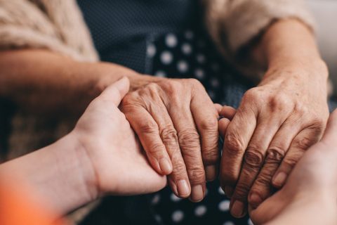 Family members holding hands