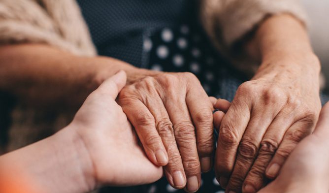 Family members holding hands