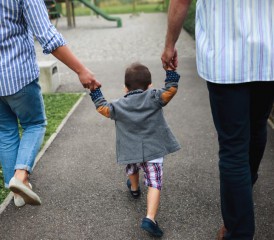 Family walking with a child