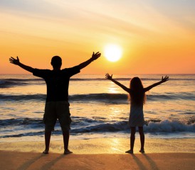 Father and daughter on a beach.