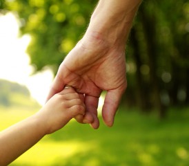 Man holding daughter's hand.
