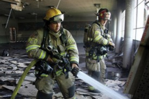 Firefighters inside a building