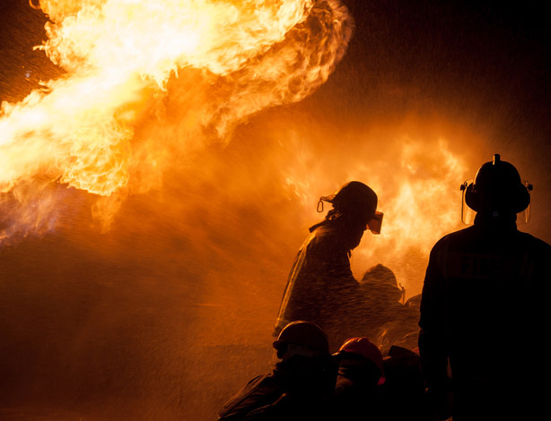 Firefighters trying to put out a fire