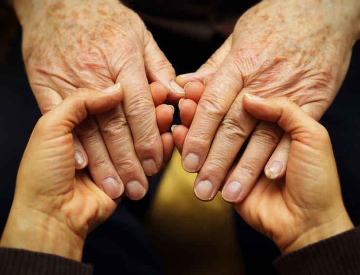 Hands held in support Hands held in support