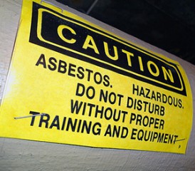 Black and yellow asbestos warning sign