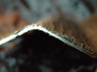 Edge of metal sheet with asbestos