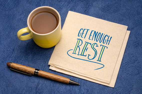 Mug of coffee with card and pen