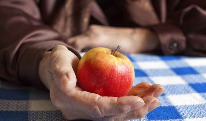 Apple in a person's hand