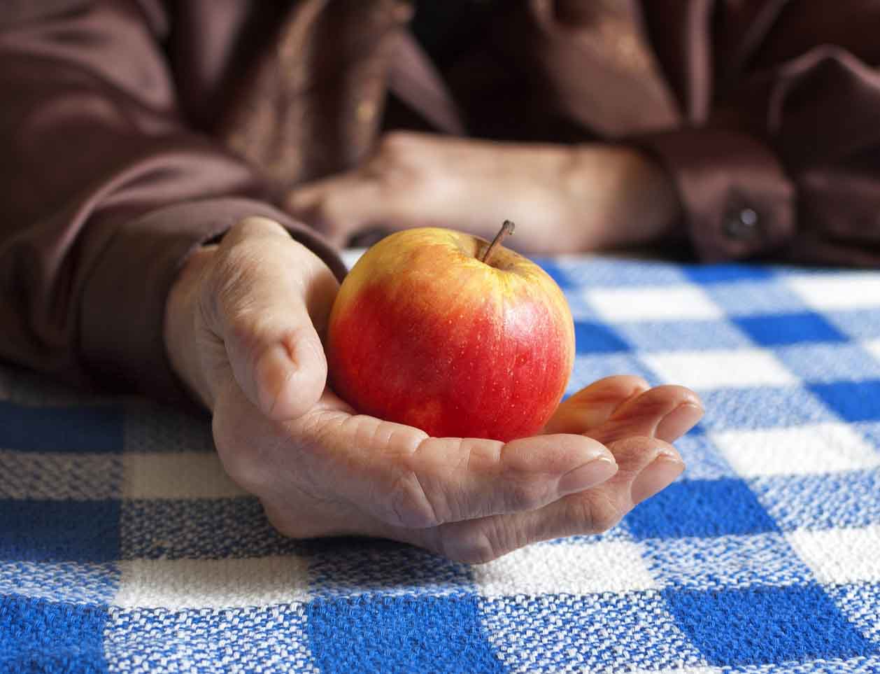 Apple in a person's hand Apple in a person's hand