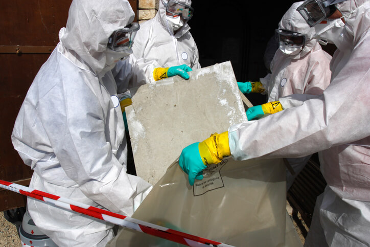 Abatement workers handling asbestos-contaminated products