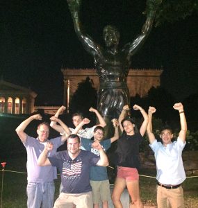 Walter Merth with family and hands raised