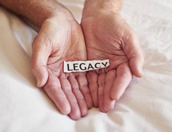 Hands holding a legacy note