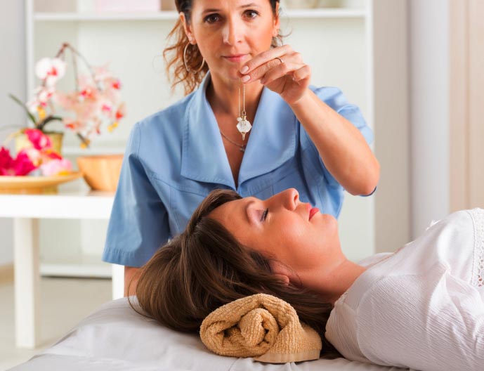 Hypnotherapist is treating a woman Hypnotherapist is treating a woman