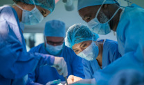 Surgical oncologists performing an operation