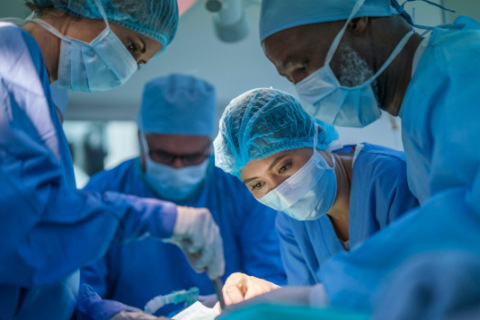 Surgical oncologists performing an operation