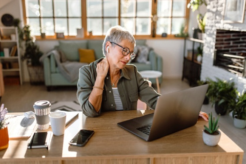 Woman using laptop at home