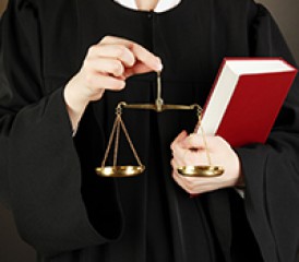 Judge holding scales in hands