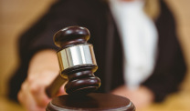 Judge with hand on gavel