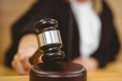 Judge with hand on gavel