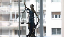 Blind justice statue in window